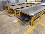 a lot of tables and benches in a warehouse
