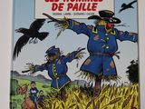 un livre sur lequel figurent l'image d'un épouvantail et d'un corbeau