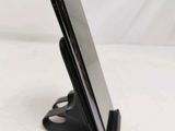 a cell phone that is sitting on a stand