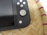 a video game controller sitting on top of a wicker basket