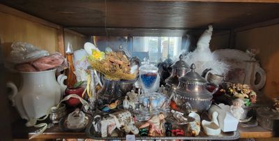 a wooden shelf with a lot of different items on it