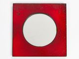 a red picture frame with a white circle in it