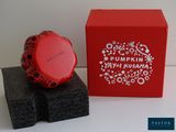 a red box with a black and white design on it