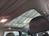 the interior of a car with the sun shining through the roof