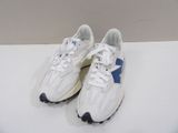 white and blue sneakers with black soles on a white surface