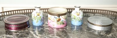 three jars on a tray on a marble table