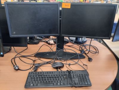 two computer monitors and a keyboard on the desk
