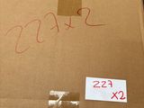 a cardboard box with a price tag on it in a warehouse