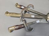 three different types of knives that are on a table