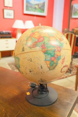 a small globe on a table in a room