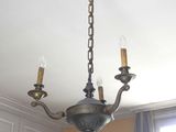 a chandelier hanging from the ceiling in a room