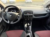 the interior of a small car with a steering wheel and dashboard