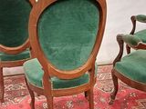 three chairs that are sitting on a rug