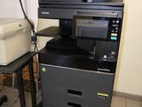 an image of a printer and a printer stand in a room