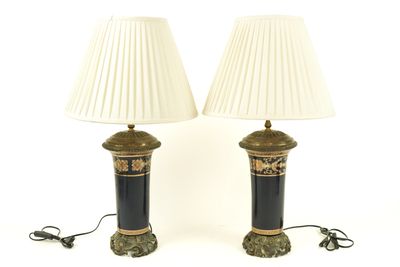 pair of black and gold table lamps with white shades