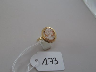 a ring with a picture of a woman on it and a price tag