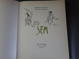 un livre ouvert sur lequel figure le dessin d'une femme et d'un homme en train de courir