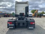 a picture of a dump truck parked in a parking lot