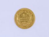 a gold coin with a picture of a horse on it