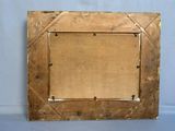 an old wooden picture frame on a table with a blue background