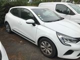 a white car parked in a parking lot next to other cars