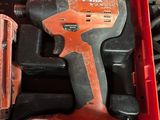a red tool box with tools in it on a table