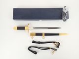 a close up of a knife and other items on a white surface