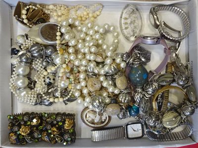 a white box filled with assorted jewelry and accessories