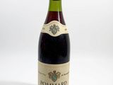 a bottle of wine that is sitting on a table