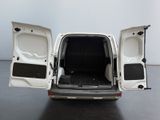 a white van with its doors open on a black floor