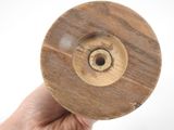a person holding a wooden object in their hand