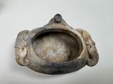 a close up of a clay object on a table