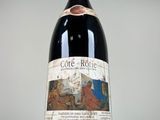 a bottle of wine that is sitting on a table