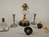 a lot of glass and brass items on the table