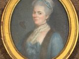 portrait of a woman in a blue dress with a white hat