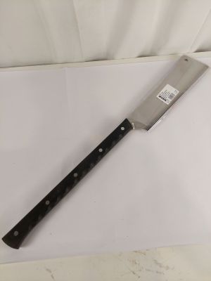 a large knife on a cutting board on a table