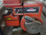 a small engine that is sitting on a cart