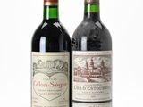 two bottles of wine sitting next to each other on a white surface