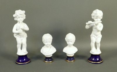 three figurines of a boy with a flute, a boy with a flute, and a boy with a flute