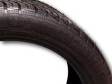 a close up of a tire on a white background with a white background