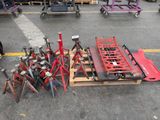 a lot of tools on a pallet in a parking lot