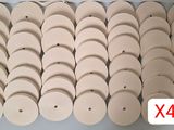 a bunch of wooden discs sitting on top of a table