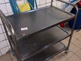 a metal cart that is sitting in a room