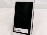 a cell phone that is sitting on top of a stand