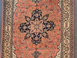 an antique persian rug with a medallion design on a blue ground