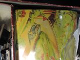 an old tin box with a picture of a car on it