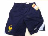 the shorts are blue and white with a yellow rooster on the side