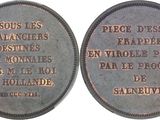 two commemorative coins with the names of people who died in france