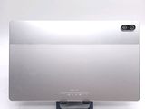 a silver computer monitor sitting on top of a desk