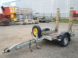 a trailer with a trailer attached to it in a parking lot